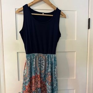 Floral print mixed media sundress.
